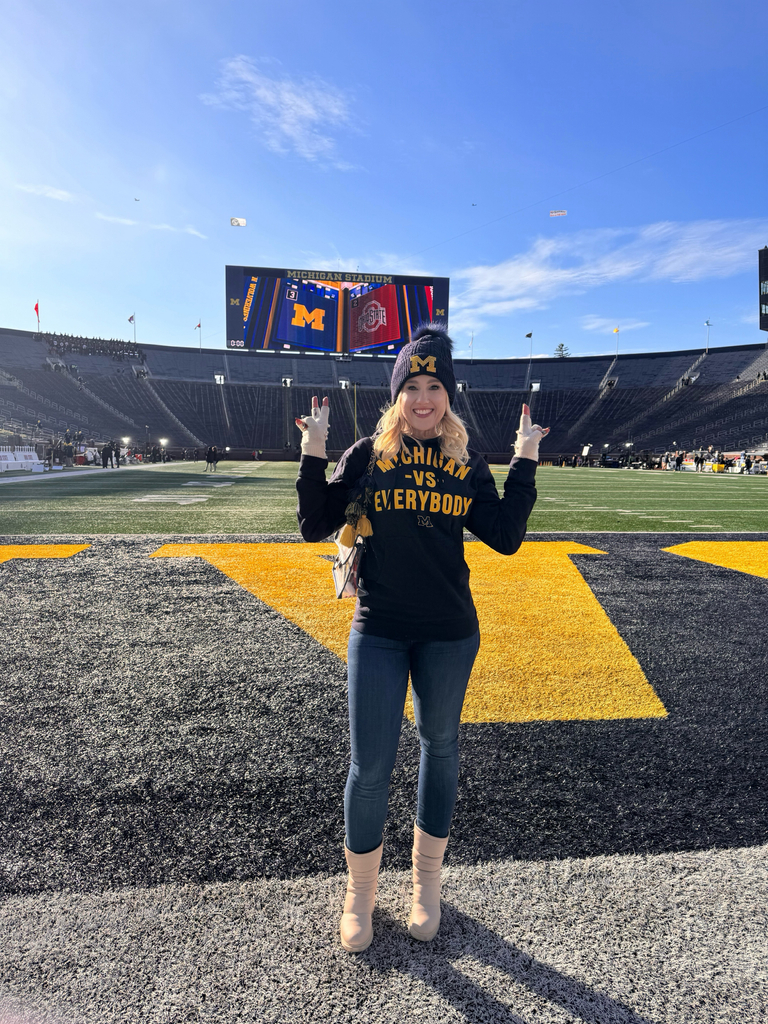 Tracy Sandler of Fangirl Sports Network at Michigan Stadium in Ann Arbor, MI. She is an alumna of the Michigan Wolverines.