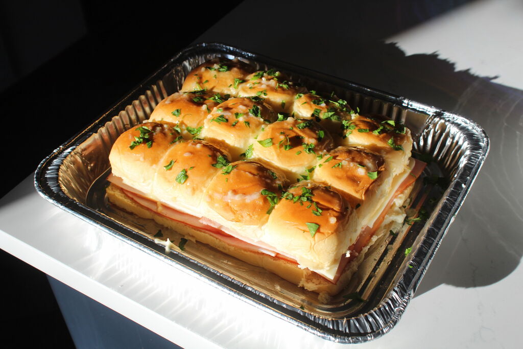 Playboy Club model Alicia Fernandez makes a batch of ham & cheese sliders for Super Bowl LIX.