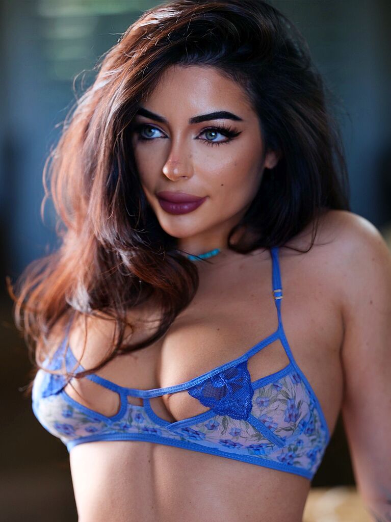 Playboy Club creator Christina Enaa is a talented poet and designer who loves Superman.