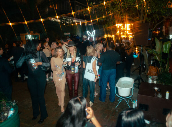 Attendees enjoying the festivities at the PLAYBOY Big Game party